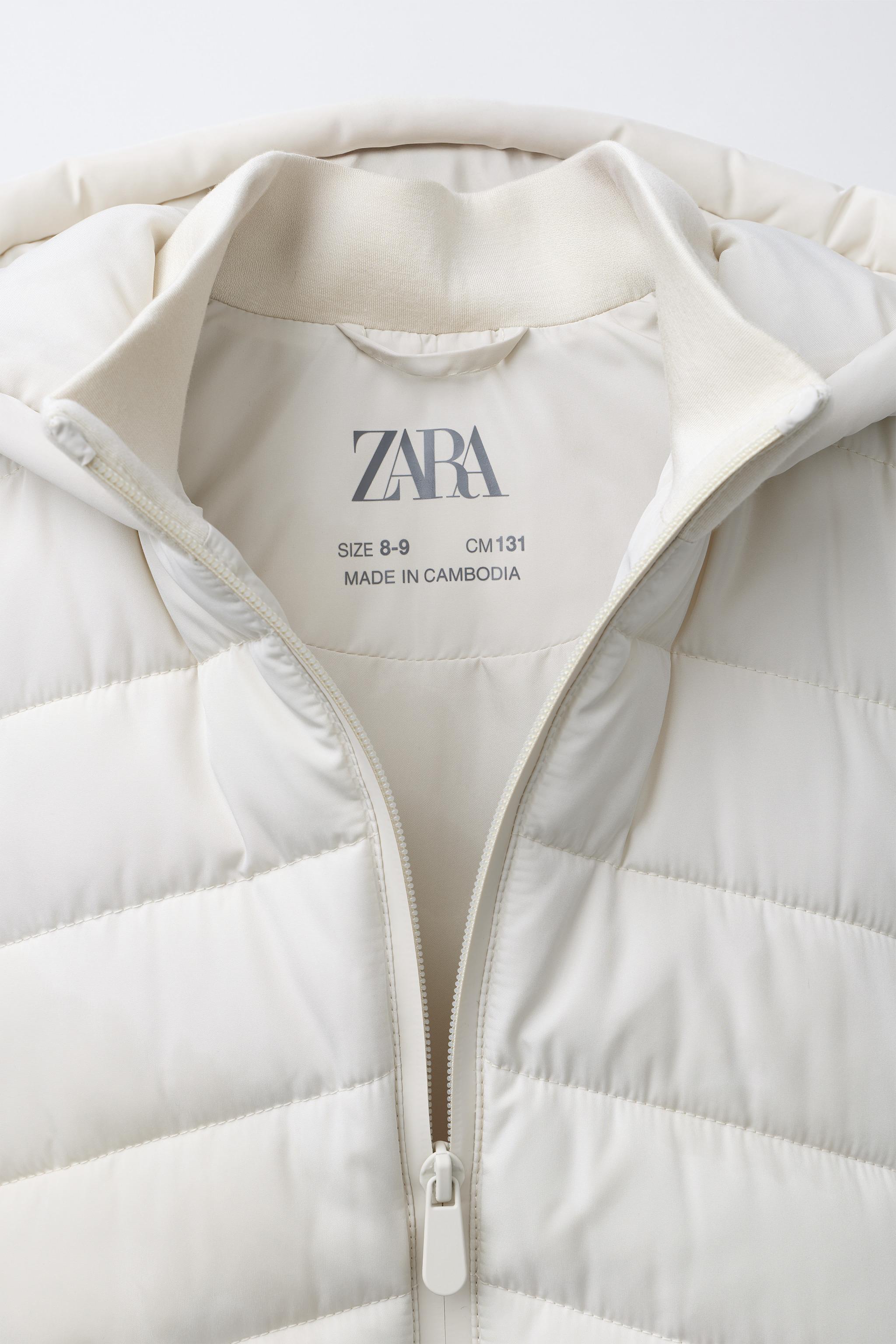 PUFFER JACKET WITH NEOPRENE EFFECT SLEEVES
